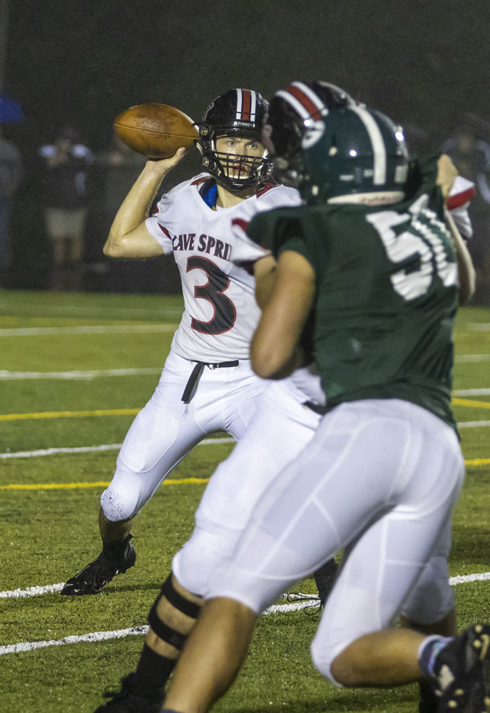 Cave Spring's (3) Lucas Duncan looks for a target as Glenvar's (50) Zach Moore tries to apply pressure.
